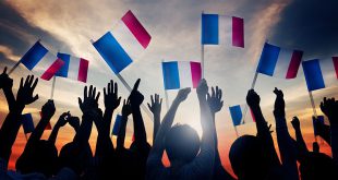 Vbet - Group of People Waving French Flags in Back Lit