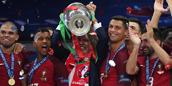 Simulated Reality - Fernando Santos(C), coach of Portugal celebrates with the trophy during the awarding ceremony after winning the Euro 2016 final football match against France in Paris, France, July 10, 2016. Portugal won 1-0.(Xinhua/Guo Yong) (Photo by Xinhua/Sipa USA)
