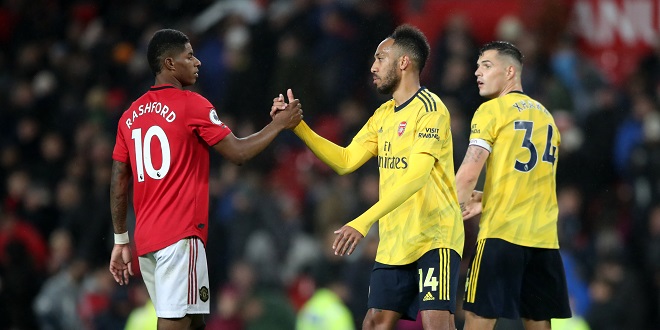 Normal Football - Manchester United's Marcus Rashford and Arsenal's Pierre-Emerick Aubameyang shakes hands after the Premier League match at Old Trafford, Manchester.