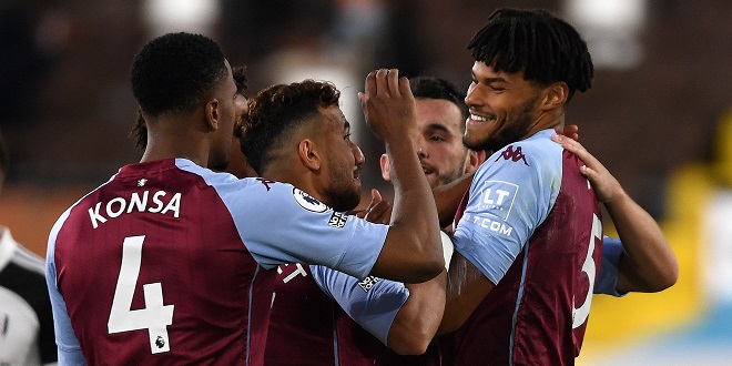 defenders - Aston Villa's Tyrone Mings (right) celebrates scoring his side's third goal of the game during the Premier League match at Craven Cottage, London.