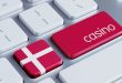 A keyboard with the Enter key saying casino, and a button with Denmark's flag next to it.