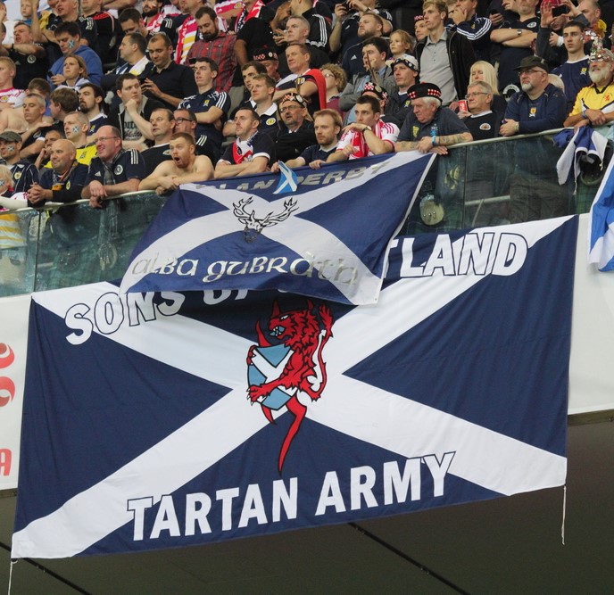 Scottish football fans wave flags 