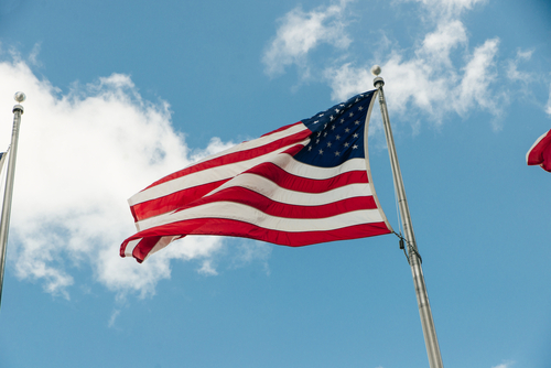 The prospects in predictions: Polymarket returns to US while key regulatory appointment delayed 3 American flag flying in the wind