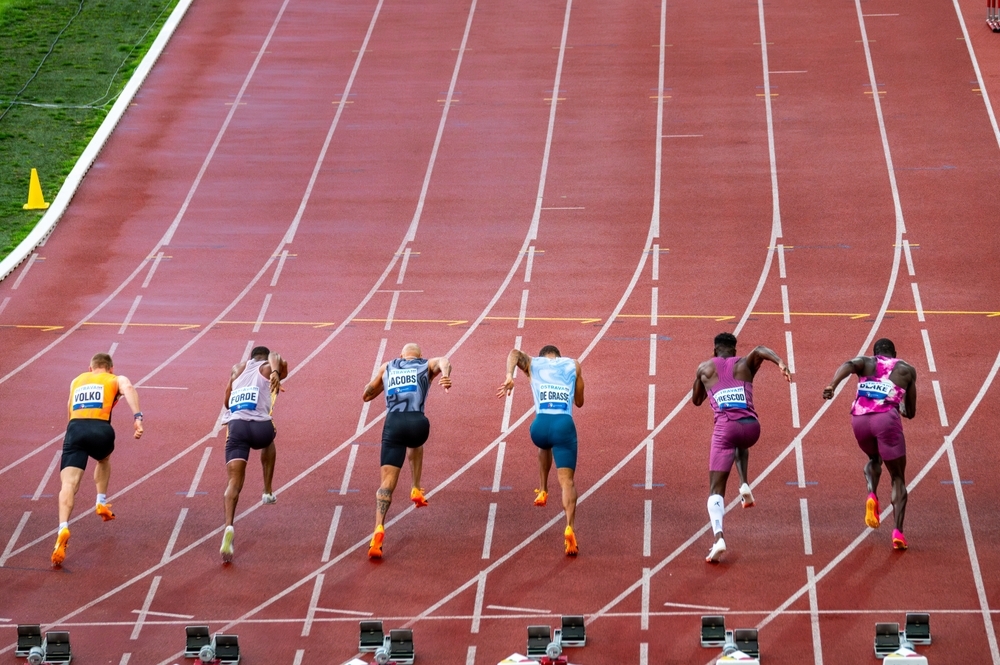 Sprinters leaving the blocks at the start of a race