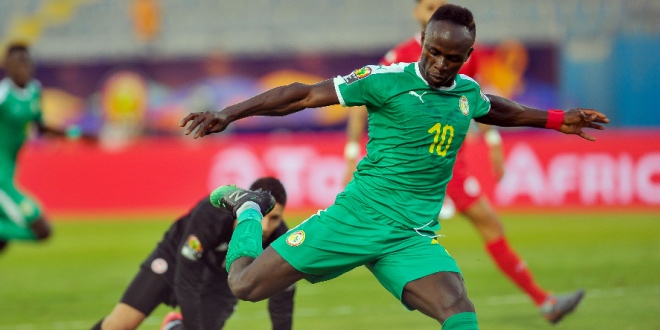 Sadio Mane kicking a ball
