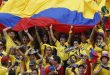 Sports fans holding the Colombia flag