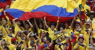Sports fans holding the Colombia flag