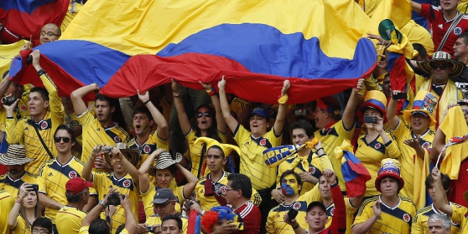 Sports fans holding the Colombia flag
