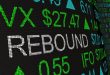 A stock exchange display with the word 'Rebound' on it