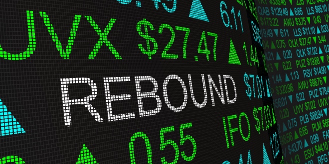 A stock exchange display with the word 'Rebound' on it