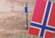 A notebook with the Norway flag on it
