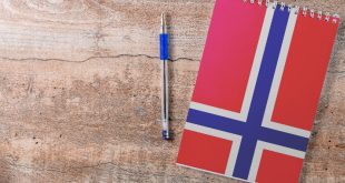 A notebook with the Norway flag on it