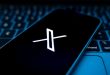 A phone showing the X app, the social media platform which has just partnered with Polymraket