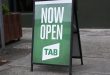 A sign for a retail Tabcorp outlet