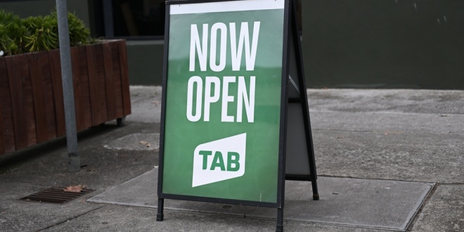 A sign for a retail Tabcorp outlet
