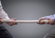 Tug of war symbolising the bidding war between MIXI and Betr over PointsBet Australia