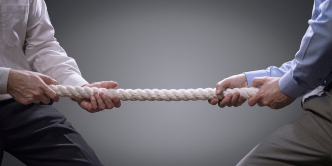 Tug of war symbolising the bidding war between MIXI and Betr over PointsBet Australia
