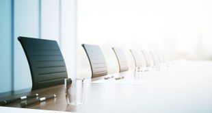 Corporate chairs around a corporate table