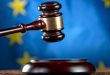 A court hammer with the EU flag in the background