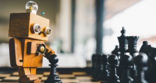 Wooden robot playing chess