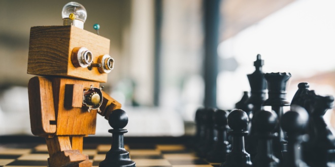 Wooden robot playing chess