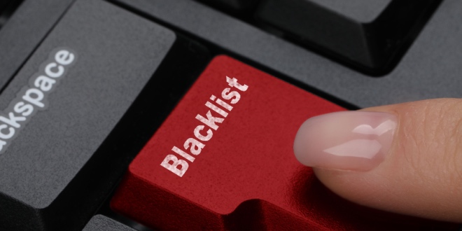A woman pressing a red button with text saying 'blacklist'