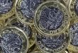 UK pound sterling coins, symbolising tax