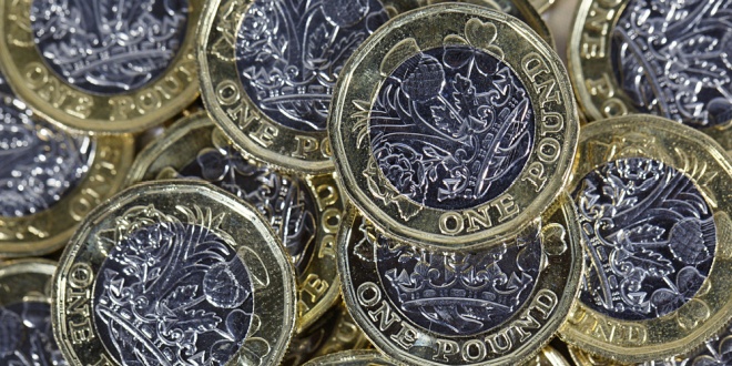 UK pound sterling coins, symbolising tax