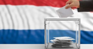 A polling station with the Dutch flag in the background