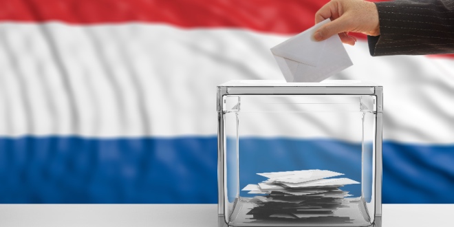 A polling station with the Dutch flag in the background
