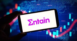 The Entain logo on a backdrop of an increasing stock