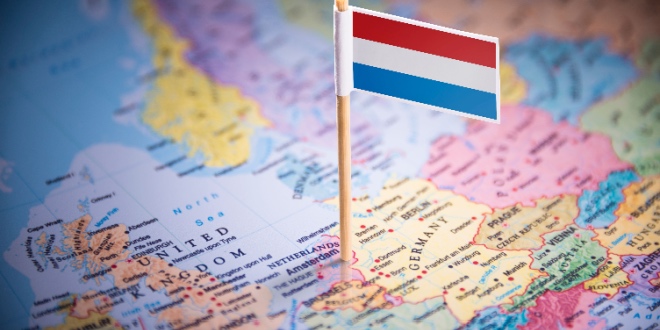 The Dutch flag pinpointing the Netherlands on a map