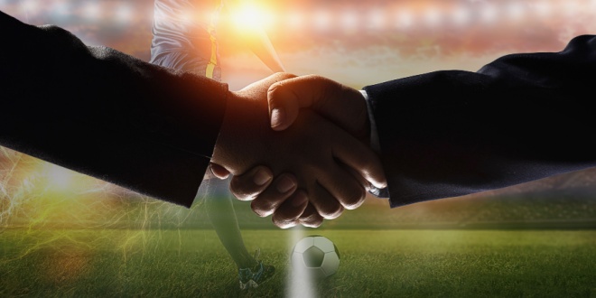 handshake on football pitch