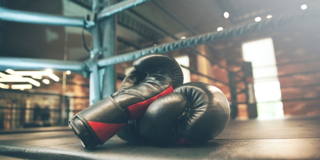 Boxing gloves in a boxing ring, symbolic of the bidding battle between MIXI and Betr over PointsBet