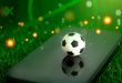 a toy football on a phone