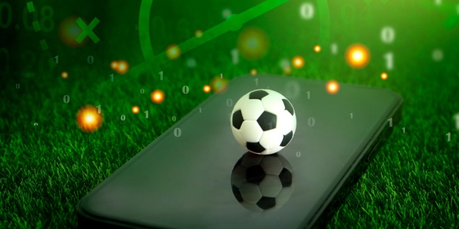 a toy football on a phone