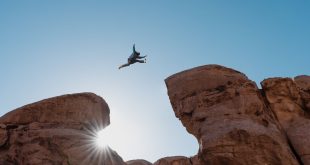 A man leaping between rocks