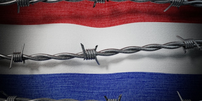 Dutch flag with barbed wire infront