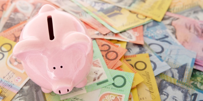 australian dollars and piggy bank