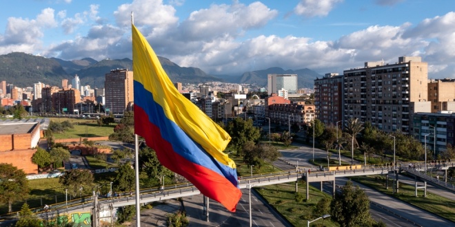 Colombian flag flying over Bogota, capital of Colombia, where Polymarket has been banned