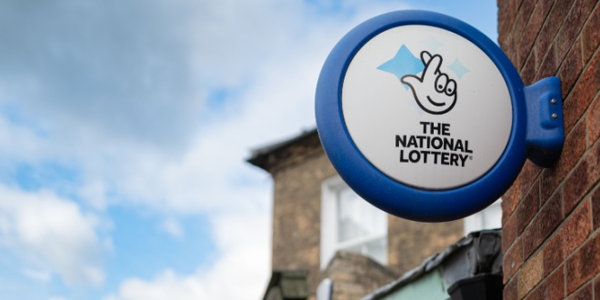 The National Lottery sign on a wall