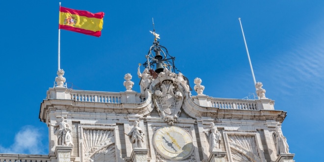 Flag of Spain flying above the Palacio Real de Madrid,