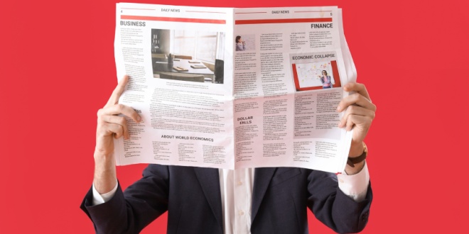 man reading newspaper