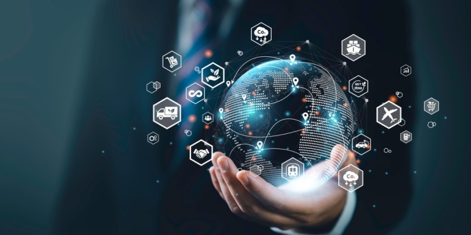 Hand holding a globe with various business icons, supply chain CEO roles and leadership