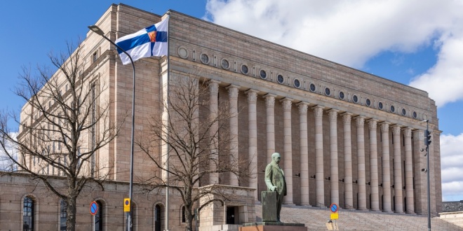The Parliament of Finland, with Finnish flag flying in foreground