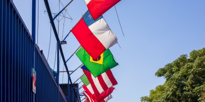 Latin American flags flying in a row