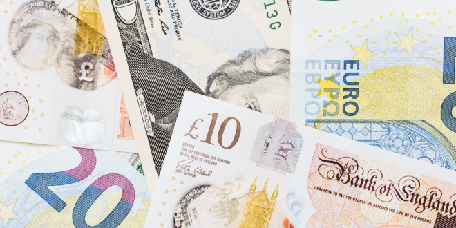 Pound sterling and euro notes, symbolic of tax across European markets