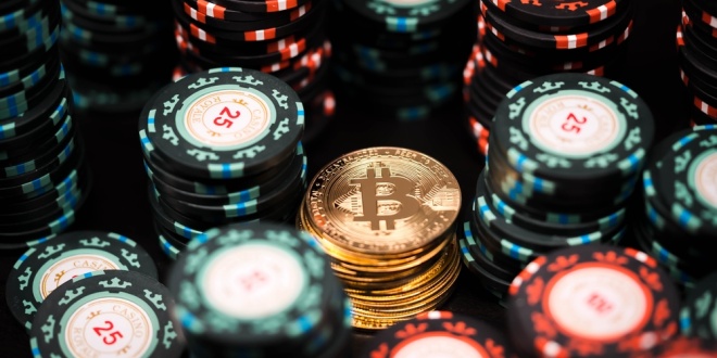 A Bitcoin among poker chips, crypto betting