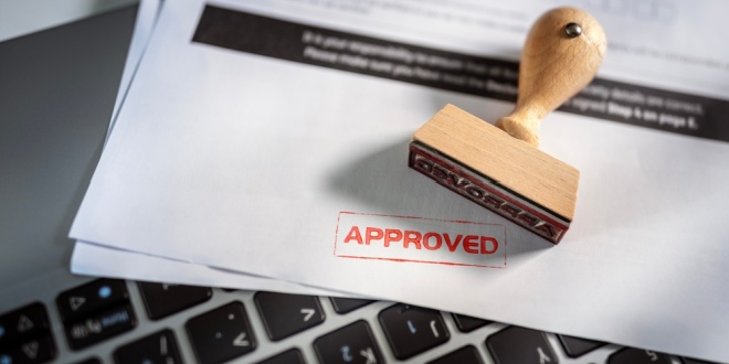 An approval stamp, symbolic of iGP's approval in Romania