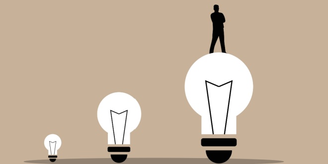 Leadership standing on light bulbs, symbolic of CEO change at Betclic Group